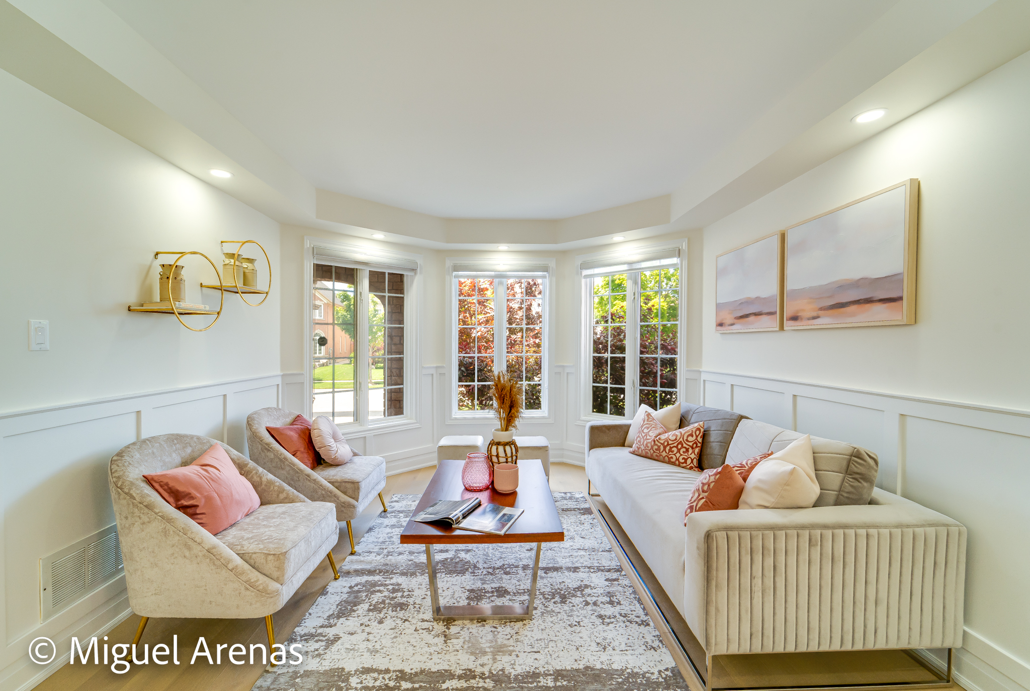 Professional real estate photography of a luxury living room with fireplace in Yorkville, Toronto